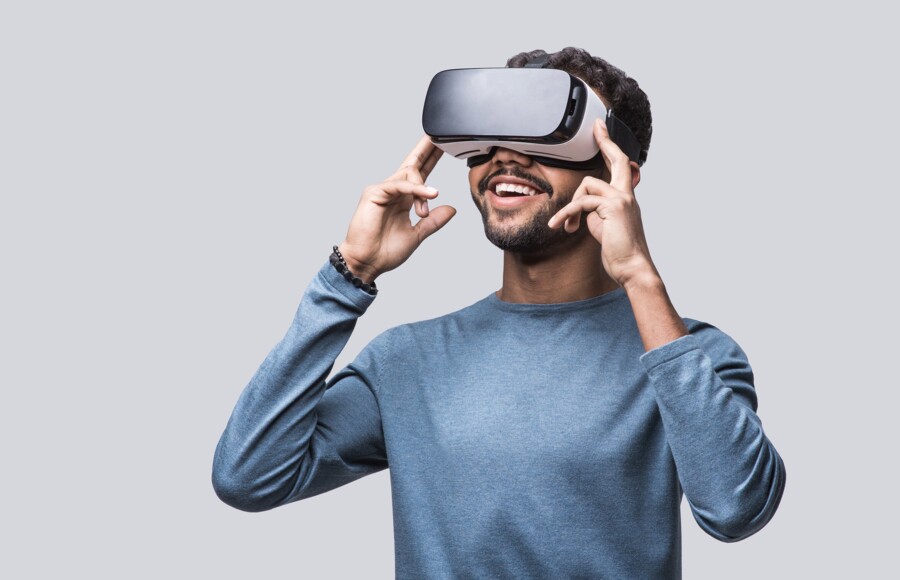 young-man-using-virtual-reality-600w-1328087891 young-man-using-virtual-reality-600w-1328087891